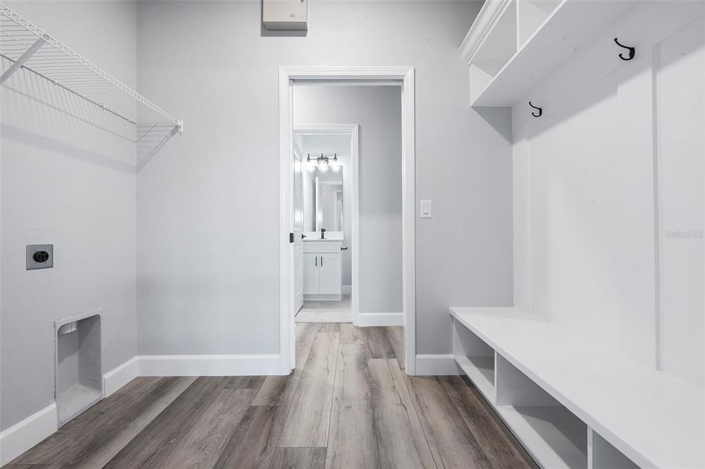 6703 Southwest 10th Lane Gainesville, FL 32607 - Photo 13 of 33 a view of hallway with wooden floor