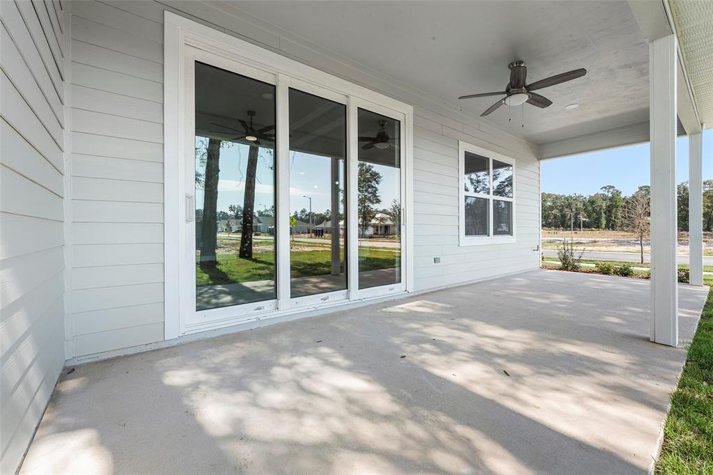 6703 Southwest 10th Lane Gainesville, FL 32607 - Photo 26 of 33 a view of an empty room with a window and a ceiling fan