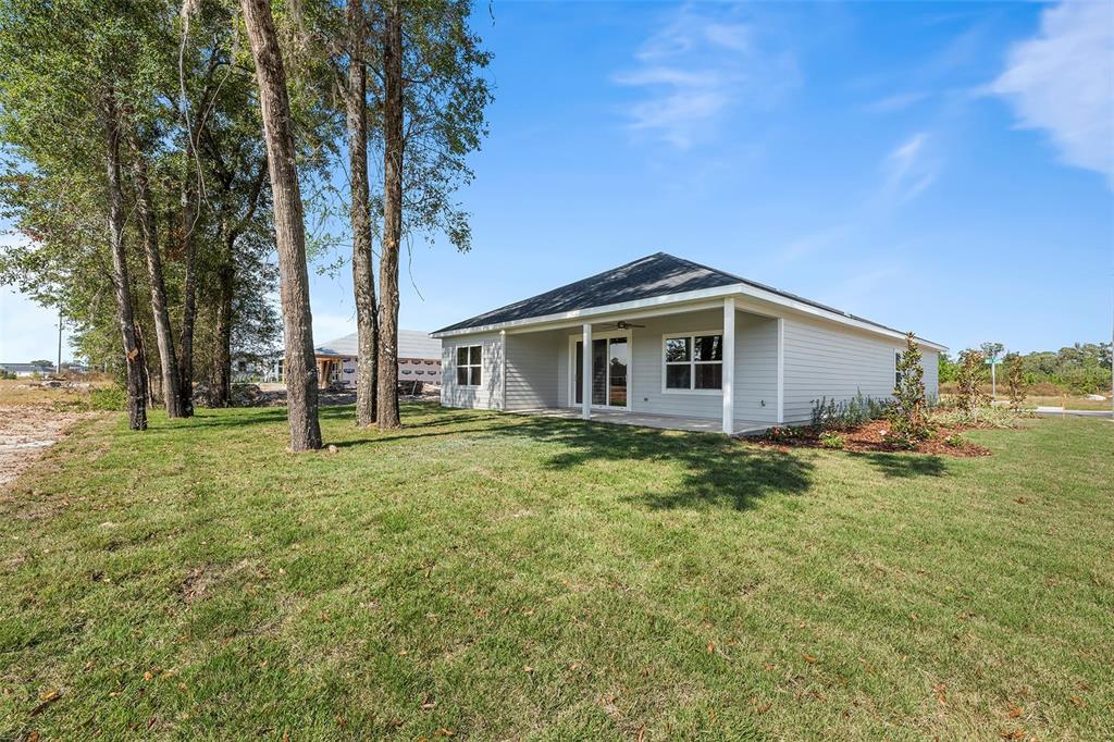 6703 Southwest 10th Lane Gainesville, FL 32607 - Photo 28 of 33 a view of a house with a backyard