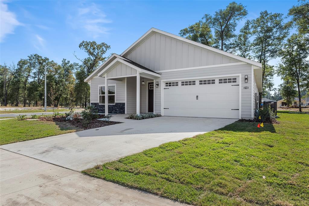 6703 Southwest 10th Lane Gainesville, FL 32607 - Photo 4 of 33 a house with green field in front of it
