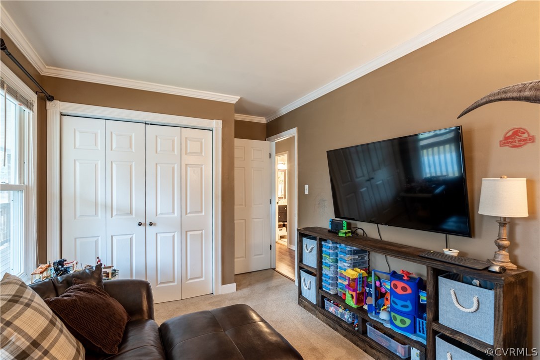 7900 Valencia Road Chesterfield, VA 23832 - Photo 39 of 44 a living room with furniture and a flat screen tv