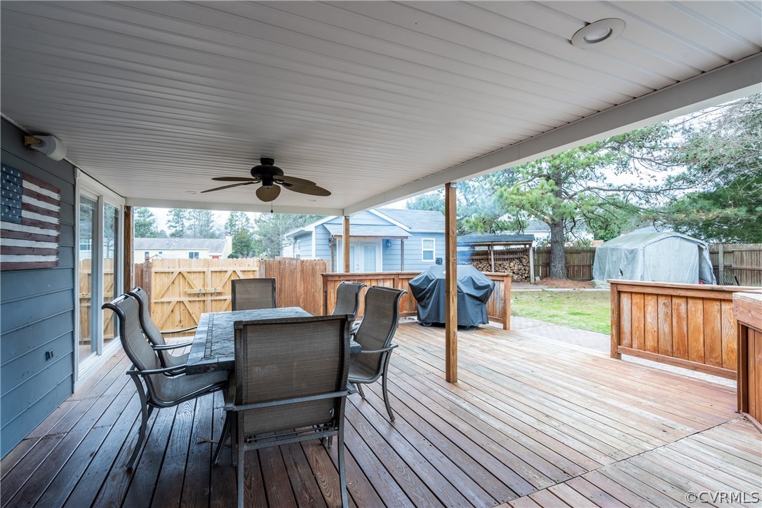 7900 Valencia Road Chesterfield, VA 23832 - Photo 8 of 44 a view of a patio with table and chairs and wooden floor