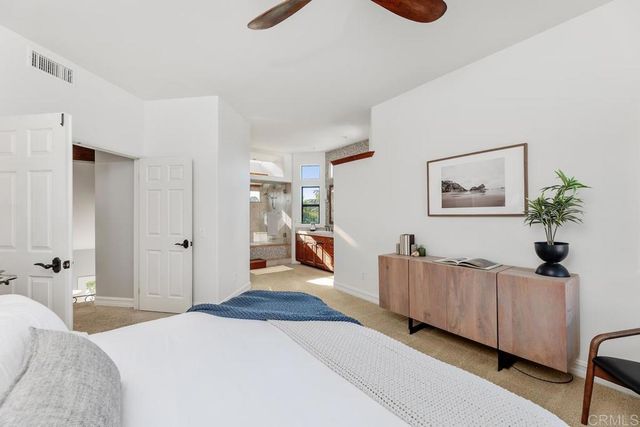 a bedroom with furniture and wooden floor