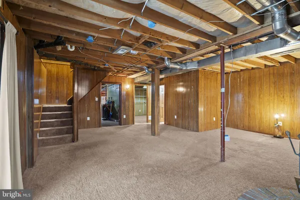 a view of a hall with wooden floor