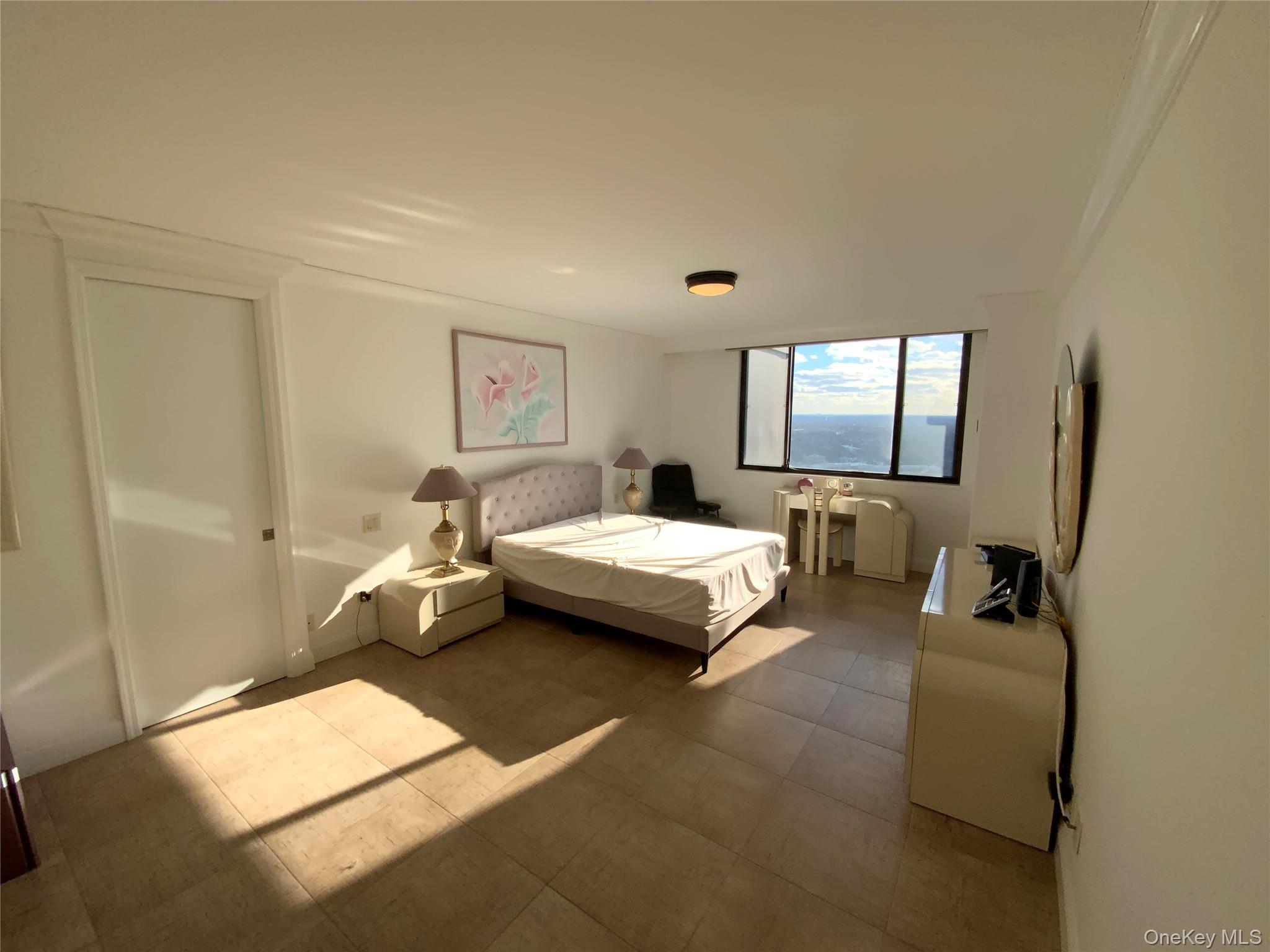 269 Grand Central Parkway, Unit 32O Queens, NY 11005 - Photo 15 of 33 a bedroom with furniture and a window