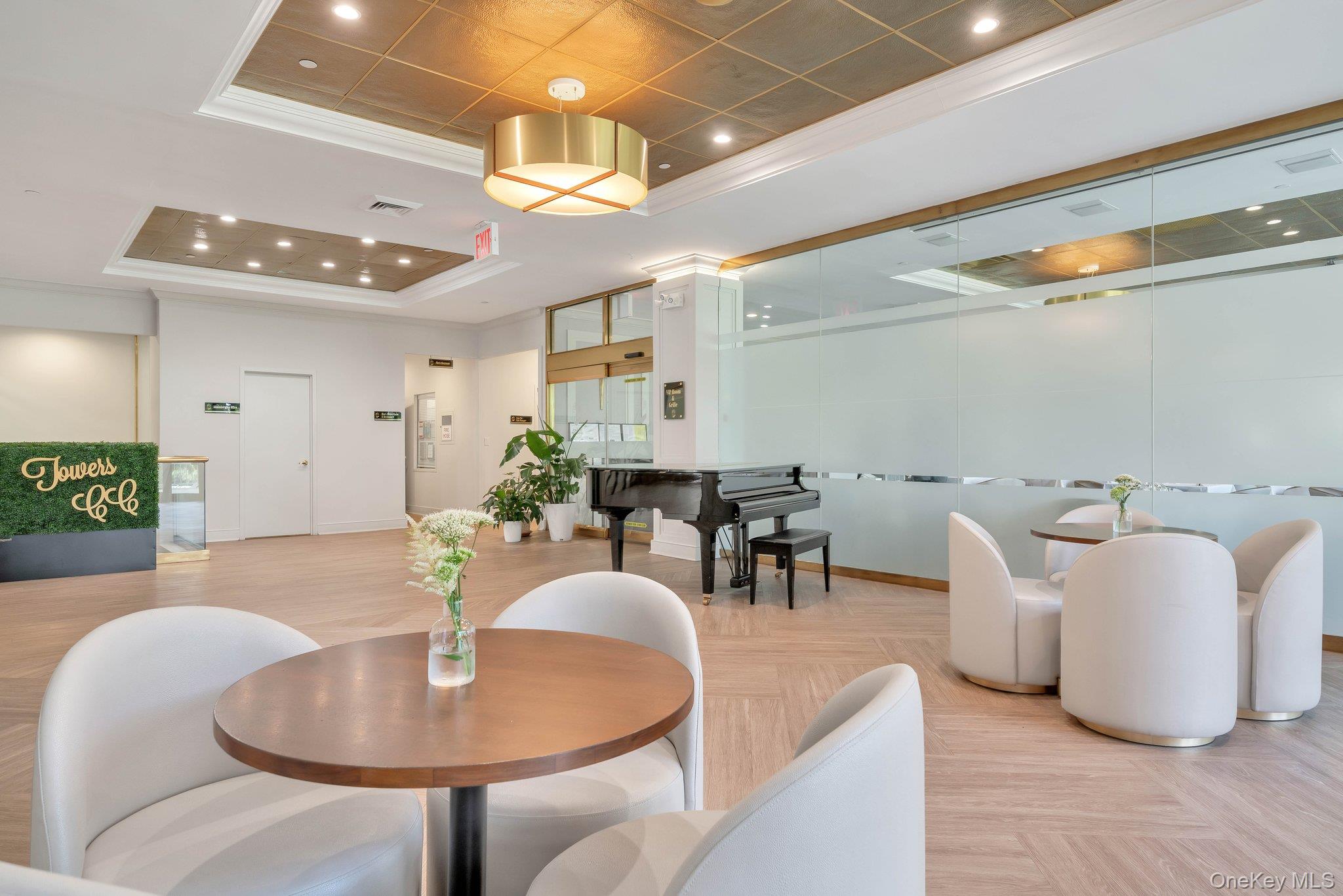 269 Grand Central Parkway, Unit 32O Queens, NY 11005 - Photo 24 of 33 a dining room with furniture and a chandelier