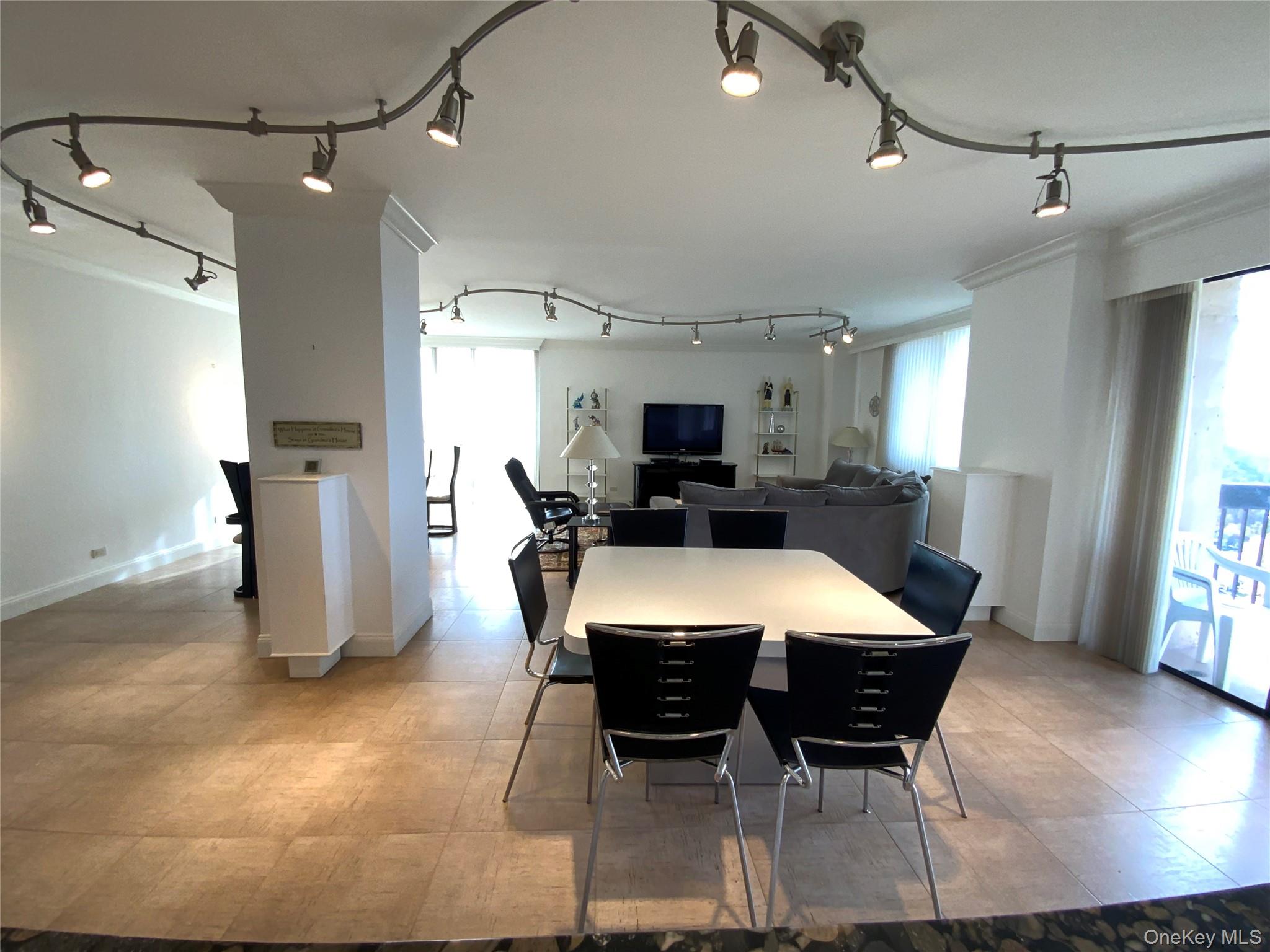 269 Grand Central Parkway, Unit 32O Queens, NY 11005 - Photo 5 of 33 a large kitchen with a table and chairs