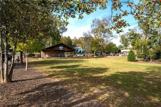a swimming pool with outdoor seating and yard