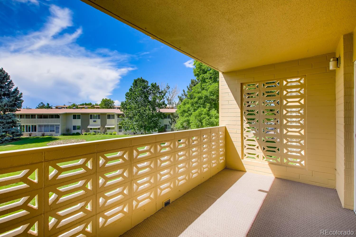 9340 Center Avenue, Unit 6B Denver, CO 80247 - Photo 27 of 40 a view of a large pool with an outdoor seating