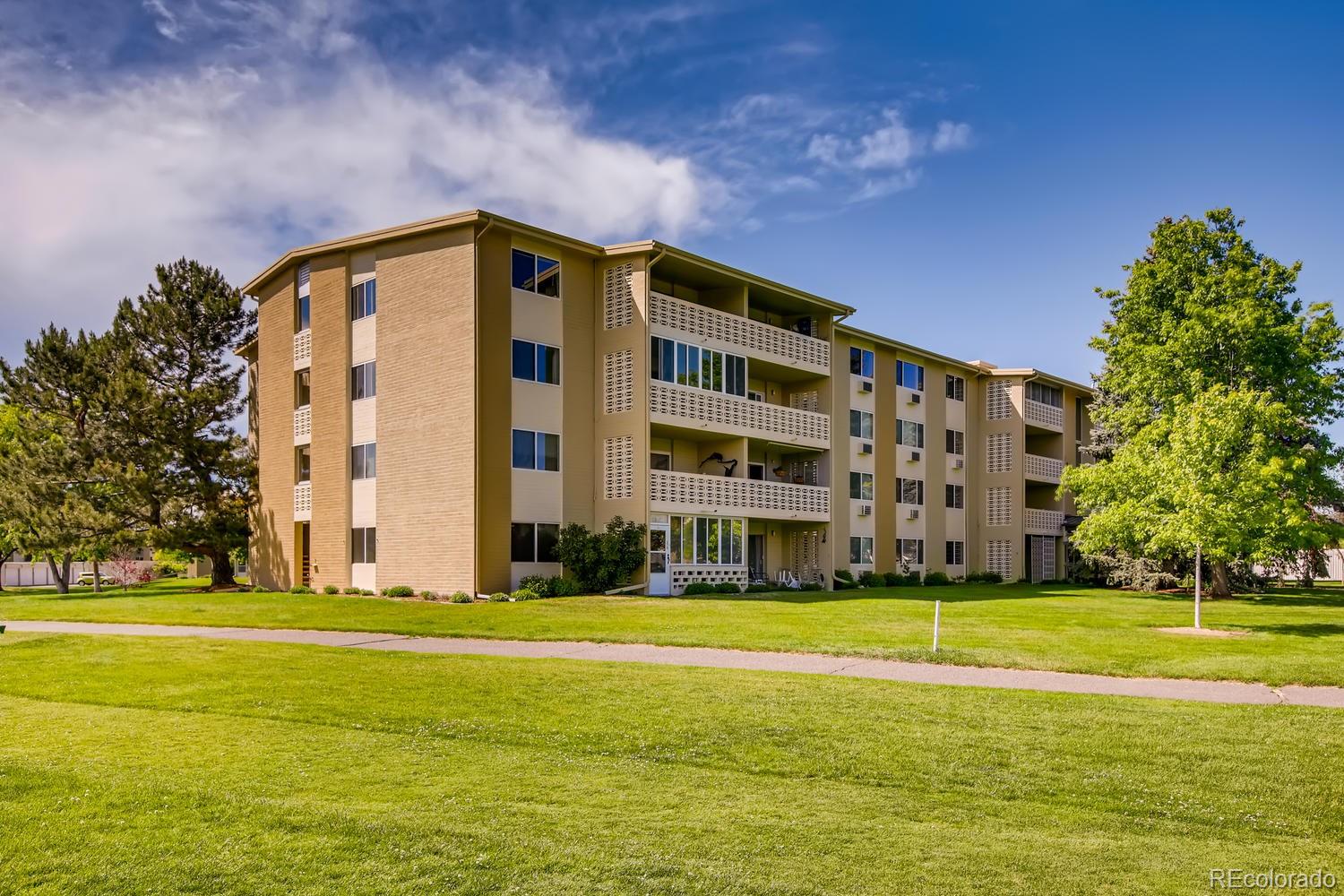 9340 Center Avenue, Unit 6B Denver, CO 80247 - Photo 32 of 40 a view of building with yard