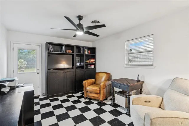 a living room with furniture and a window
