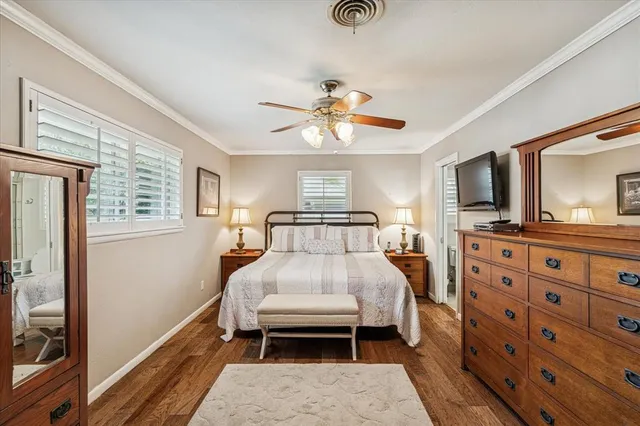 a bedroom with furniture and a flat tv screen