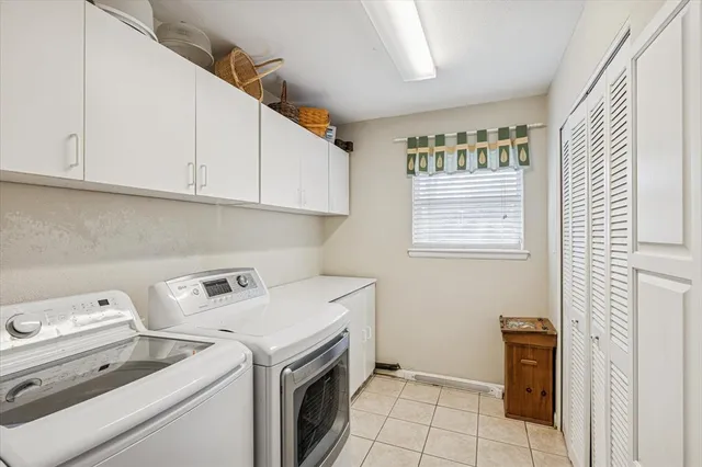 a view of storage and utility room with washer and dryer