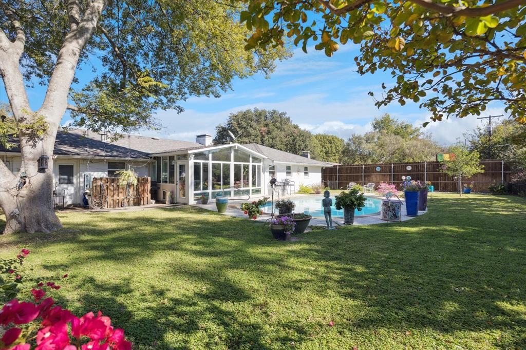 4209 Bilglade Road Fort Worth, TX 76109 - Photo 23 of 24 a view of a house with a big yard and garden