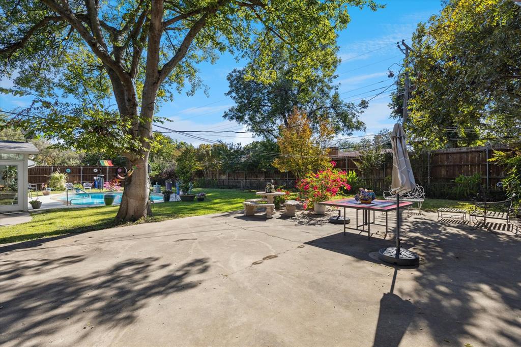 4209 Bilglade Road Fort Worth, TX 76109 - Photo 5 of 24 a view of a park with bench and trees