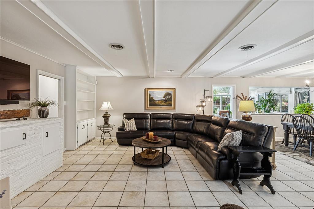 4209 Bilglade Road Fort Worth, TX 76109 - Photo 6 of 24 a living room with furniture and a flat screen tv