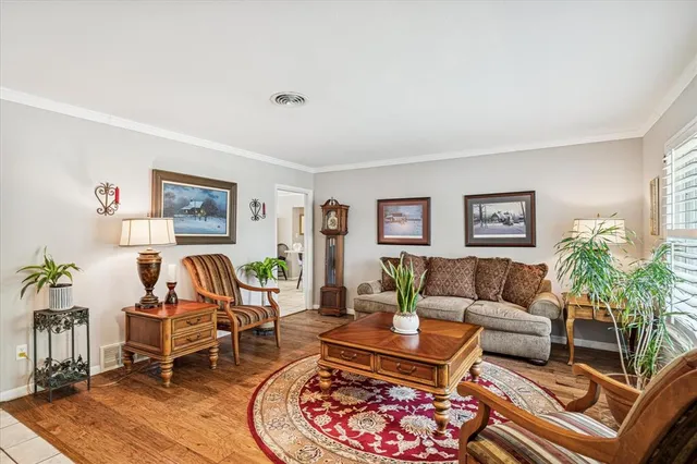 a living room with furniture and a rug