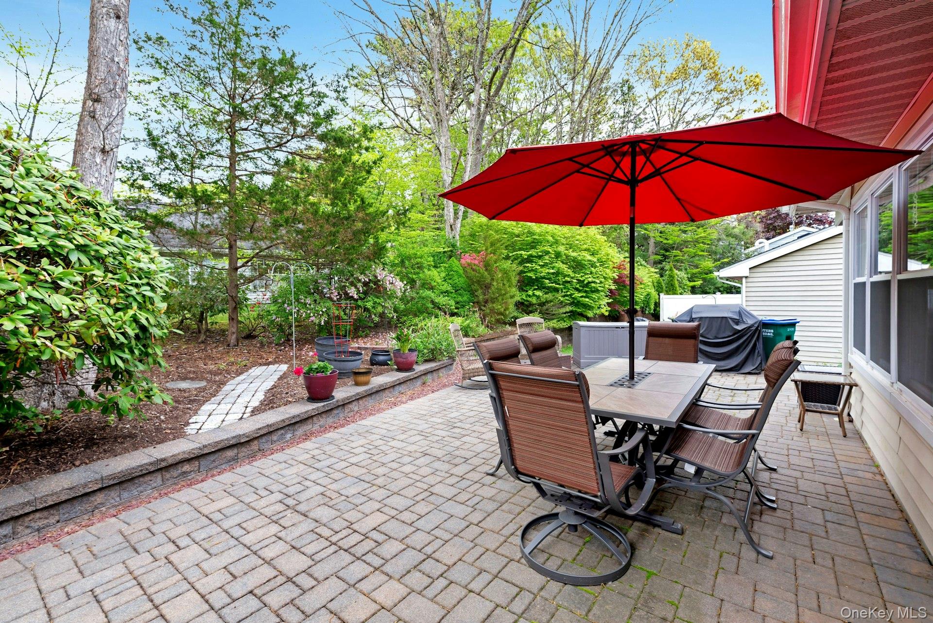 104 Glen Drive Ridge, NY 11961 - Photo 24 of 25 a view of backyard with seating space and umbrella