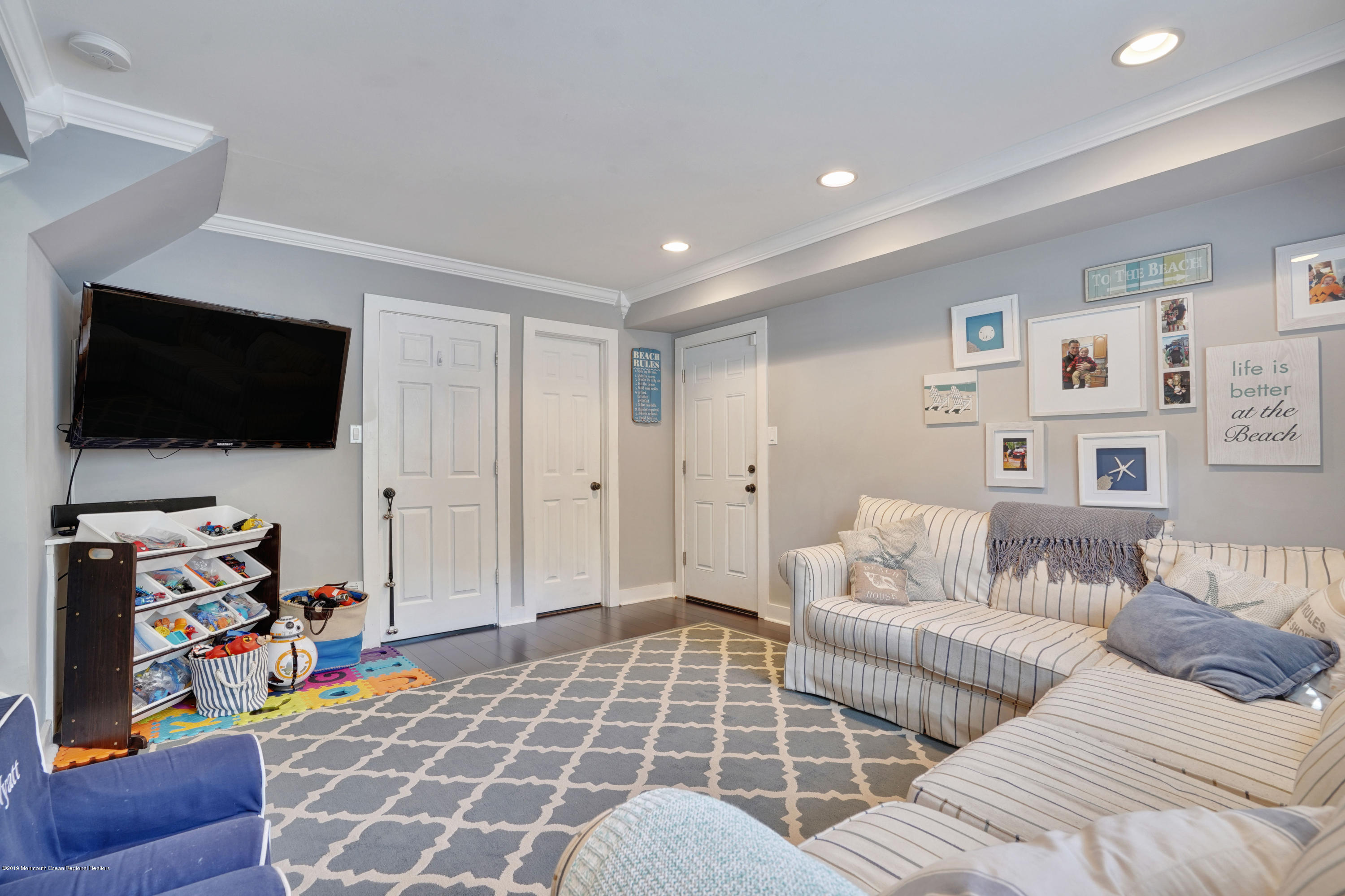 8 Dunbarton Road Jackson, NJ 08527 - Photo 20 of 34 a living room with furniture and a flat screen tv