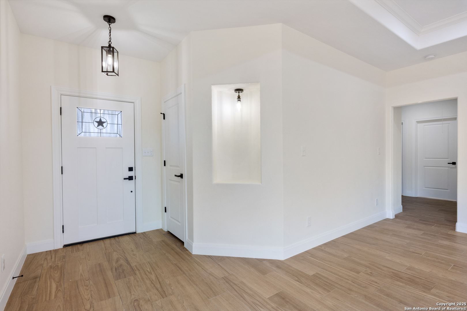 32 Trophy Lane Poteet, TX 78065 - Photo 24 of 47 a view of an empty room with wooden floor
