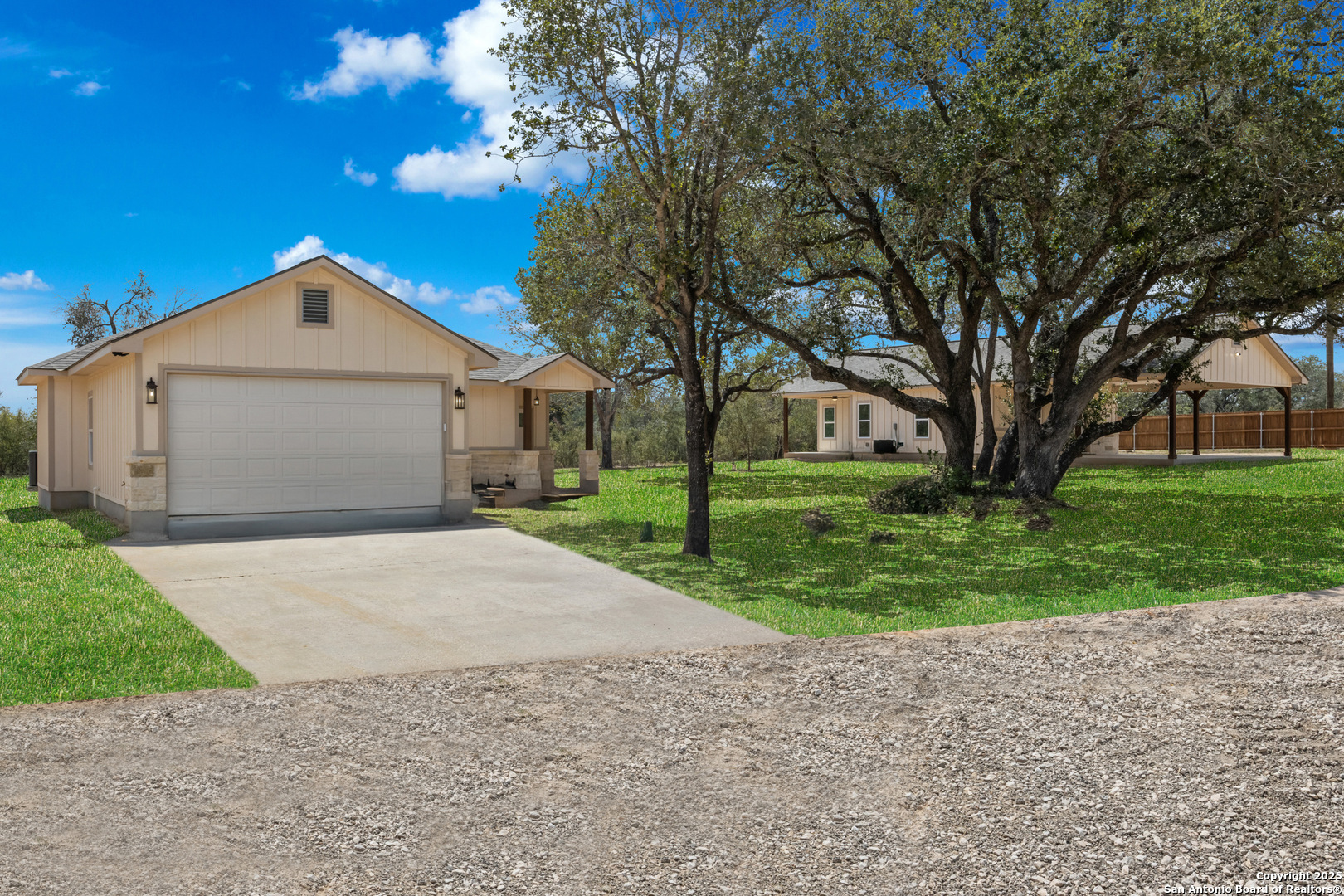32 Trophy Lane Poteet, TX 78065 - Photo 3 of 47 a front view of a house with a yard and garage