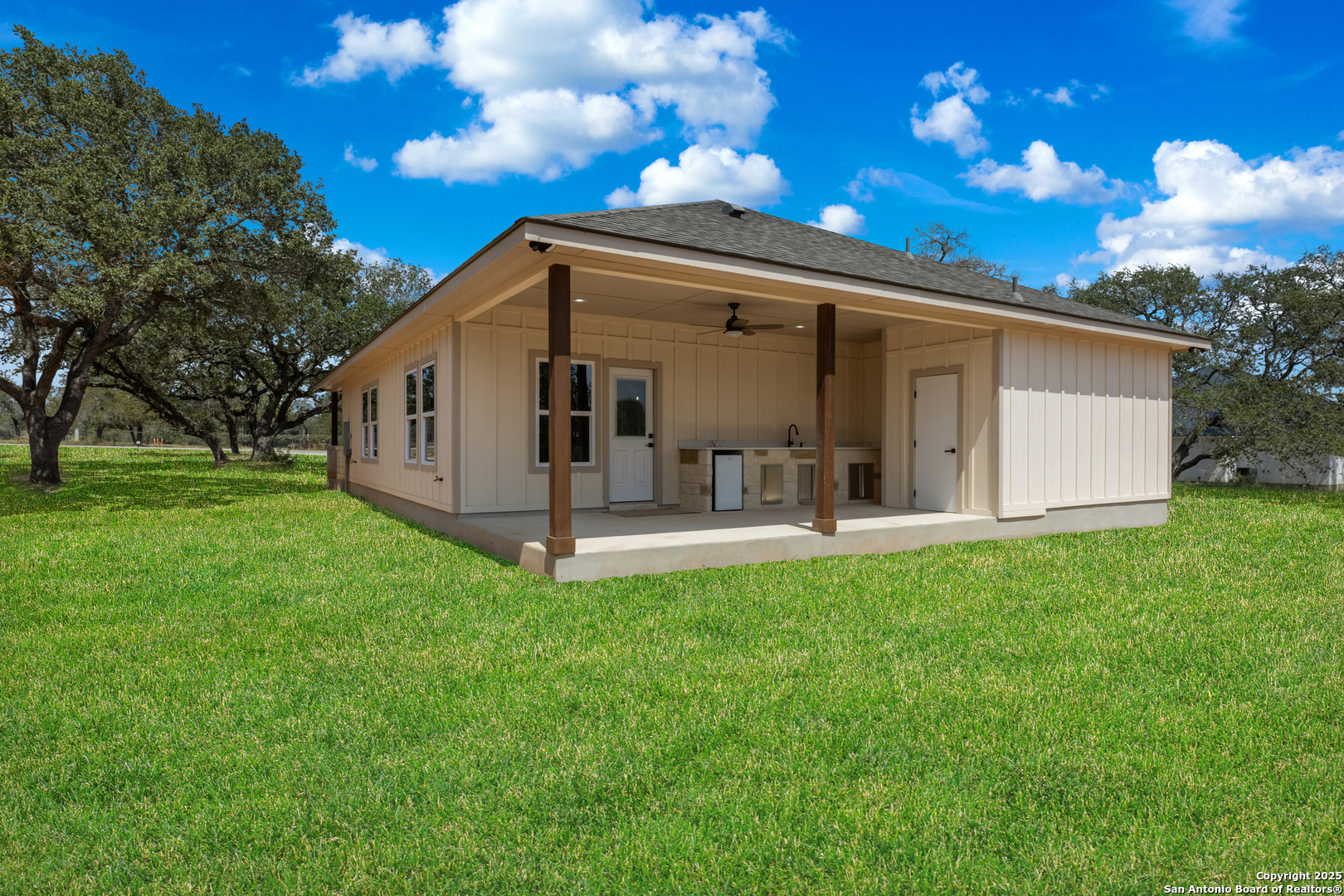 32 Trophy Lane Poteet, TX 78065 - Photo 41 of 47 a view of a back yard of the house with a fountain