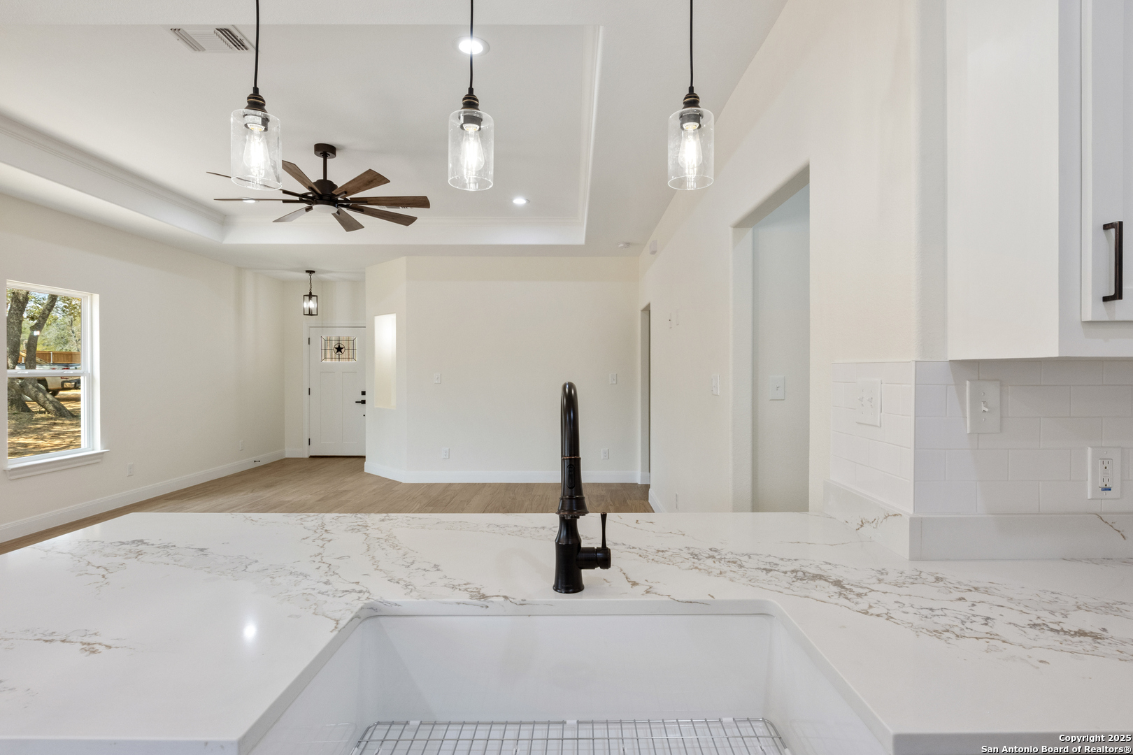 32 Trophy Lane Poteet, TX 78065 - Photo 10 of 47 a view of a kitchen with a sink and a window