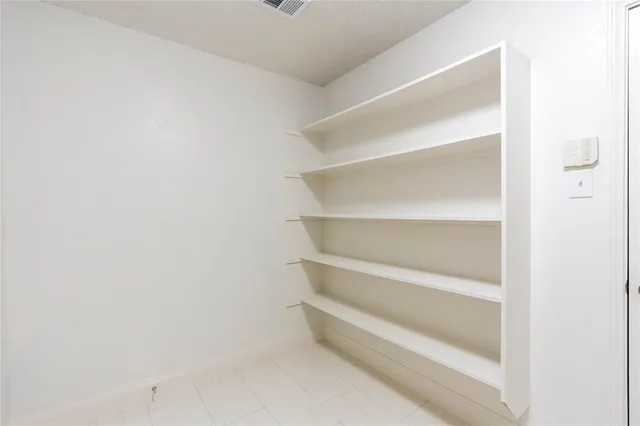 a view of an empty walk in closet
