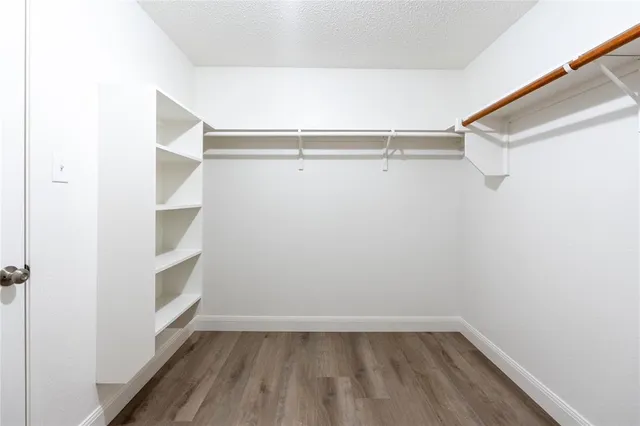 a view of an empty walk in closet