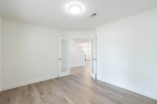 a view of entryway with wooden floor