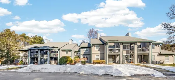 a view of a large building next to a road