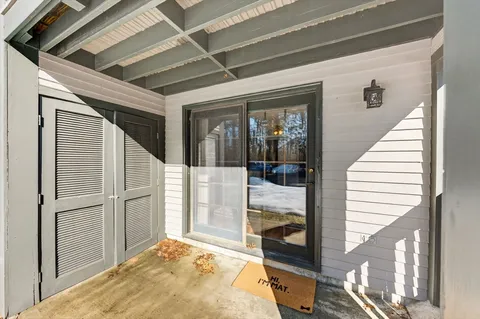 a bed room with a bed and a window