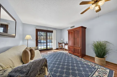 a bed room with a bed and wooden floor