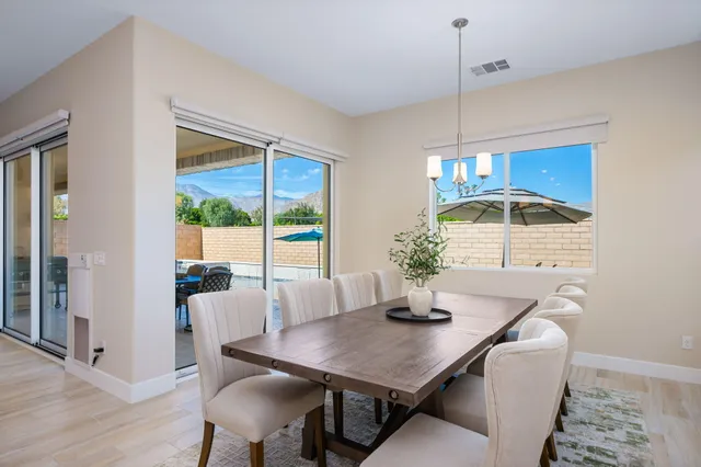 a dining room with furniture and window