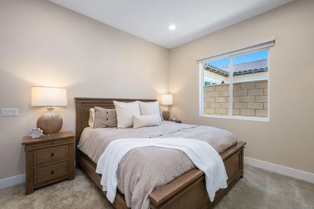 a bedroom with a bed and window