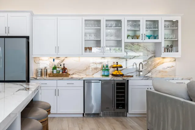 a kitchen with a sink cabinets and window