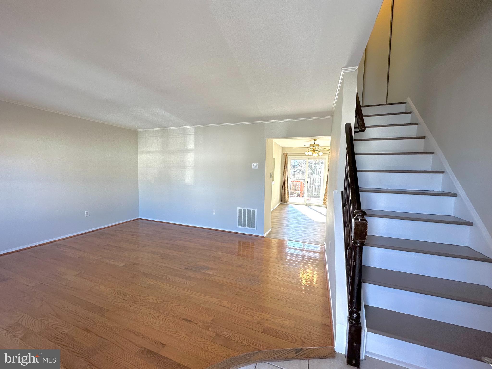402 Carousel Court Gaithersburg, MD 20877 - Photo 3 of 29 a view of an empty room with stairs