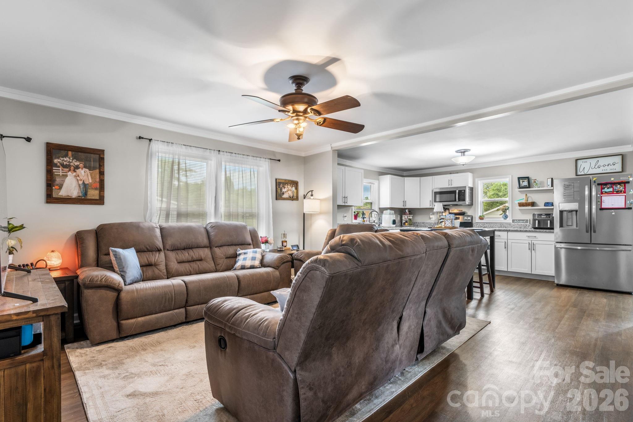 3941 Springs Road Northeast Conover, NC 28613 - Photo 5 of 21 a living room with furniture kitchen view and a chandelier