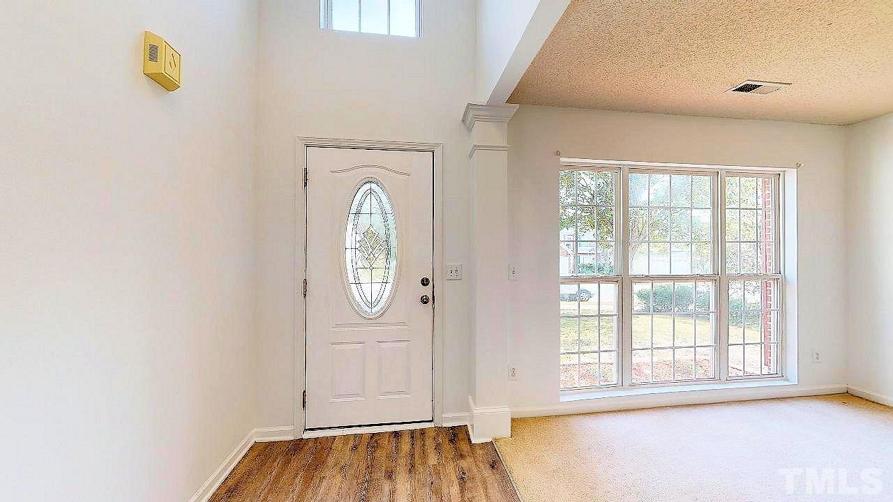 2901 Tuckland Drive Raleigh, NC 27610 - Photo 2 of 28 an empty room with windows