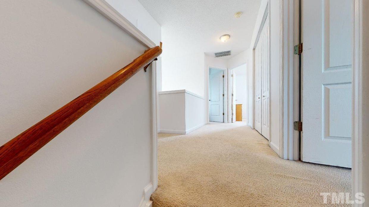 2901 Tuckland Drive Raleigh, NC 27610 - Photo 13 of 28 a view of a hallway with staircase