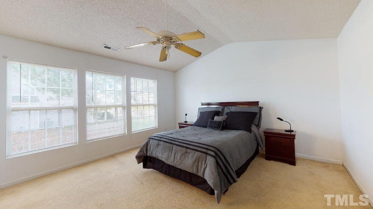 2901 Tuckland Drive Raleigh, NC 27610 - Photo 17 of 28 a bedroom with a bed and a large window