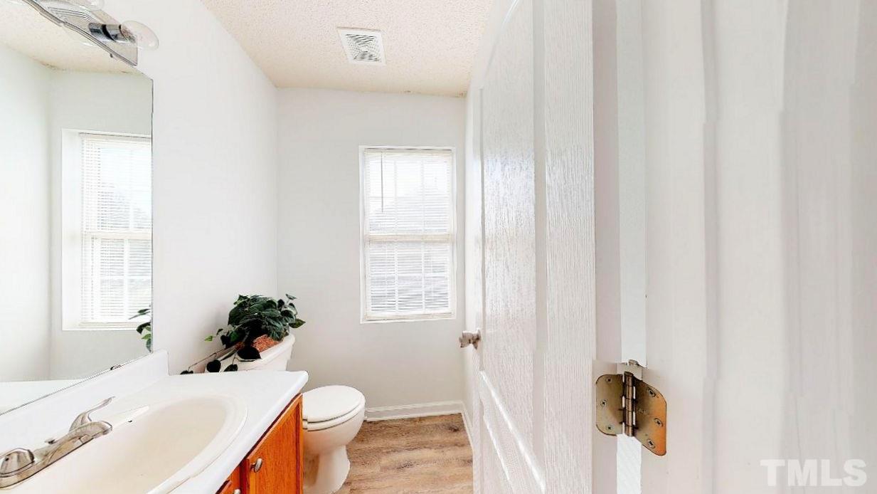 2901 Tuckland Drive Raleigh, NC 27610 - Photo 18 of 28 a bathroom with a sink toilet and shower