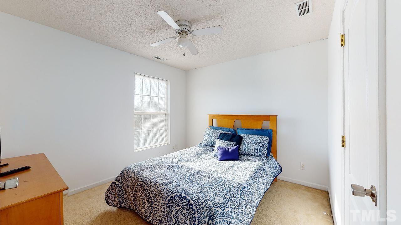 2901 Tuckland Drive Raleigh, NC 27610 - Photo 23 of 28 a bedroom with a bed and a window