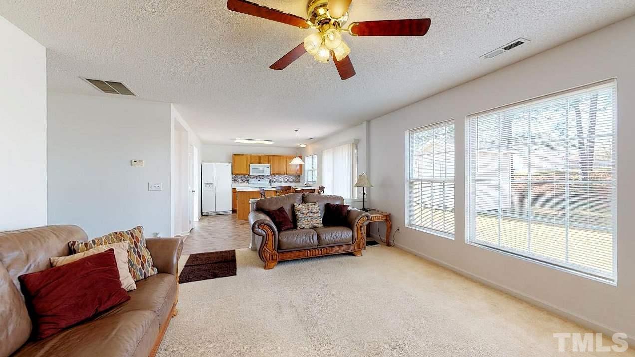 2901 Tuckland Drive Raleigh, NC 27610 - Photo 9 of 28 a living room with furniture and a large window