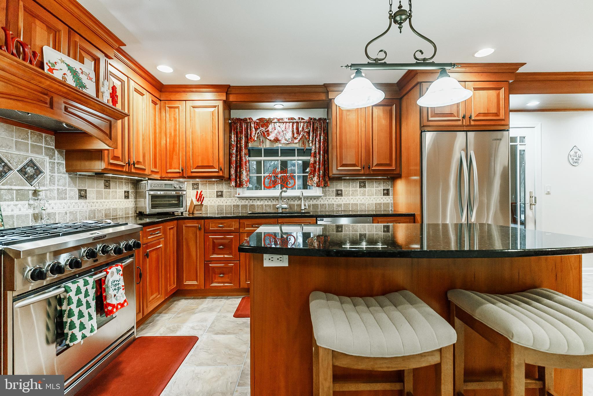 841 Rodman Avenue Jenkintown, PA 19046 - Photo 3 of 14 a kitchen with stainless steel appliances granite countertop a sink a stove and a wooden cabinets