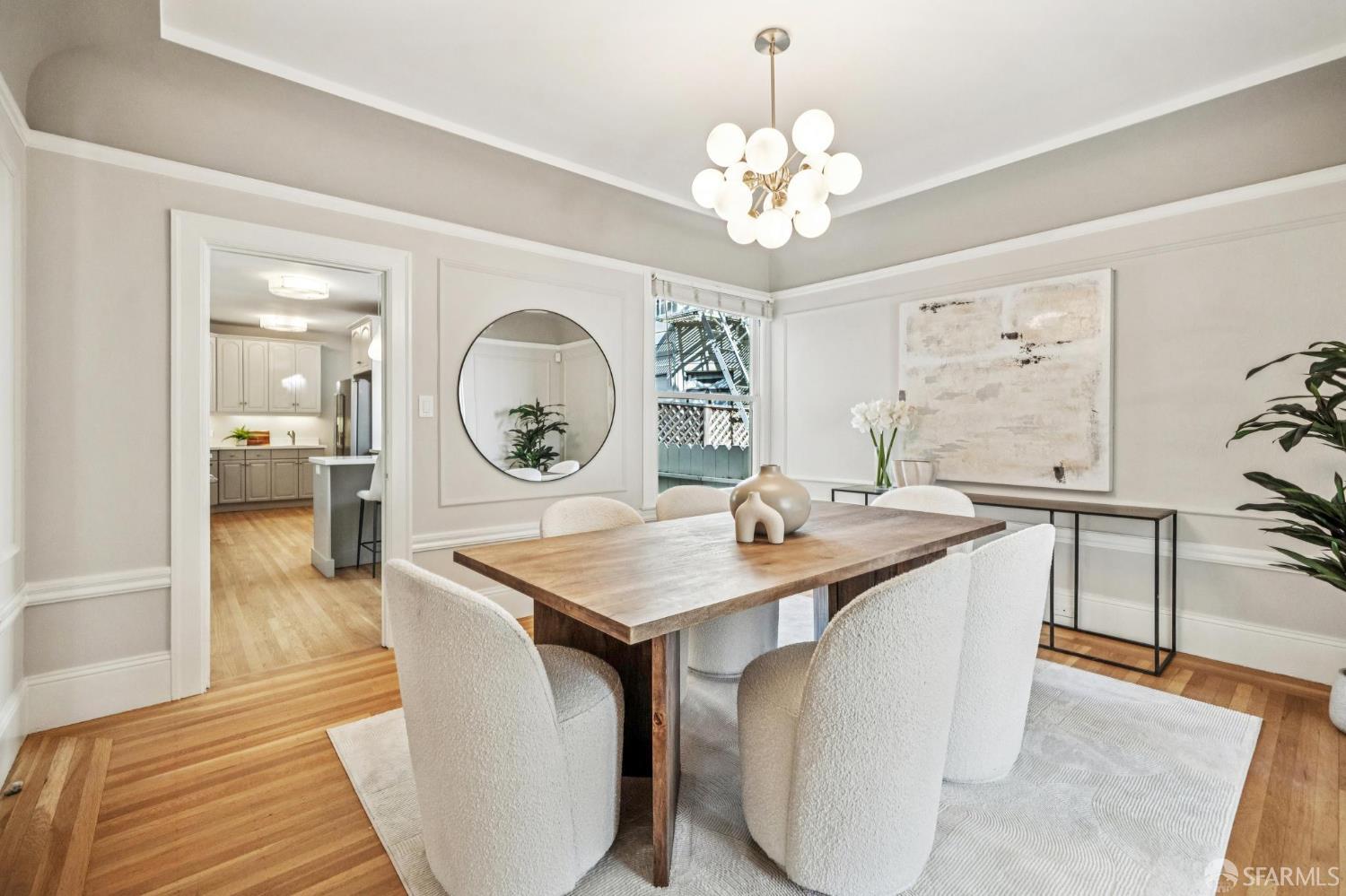 2522 Chestnut Street San Francisco, CA 94123 - Photo 11 of 34 a view of a dining room with furniture and wooden floor