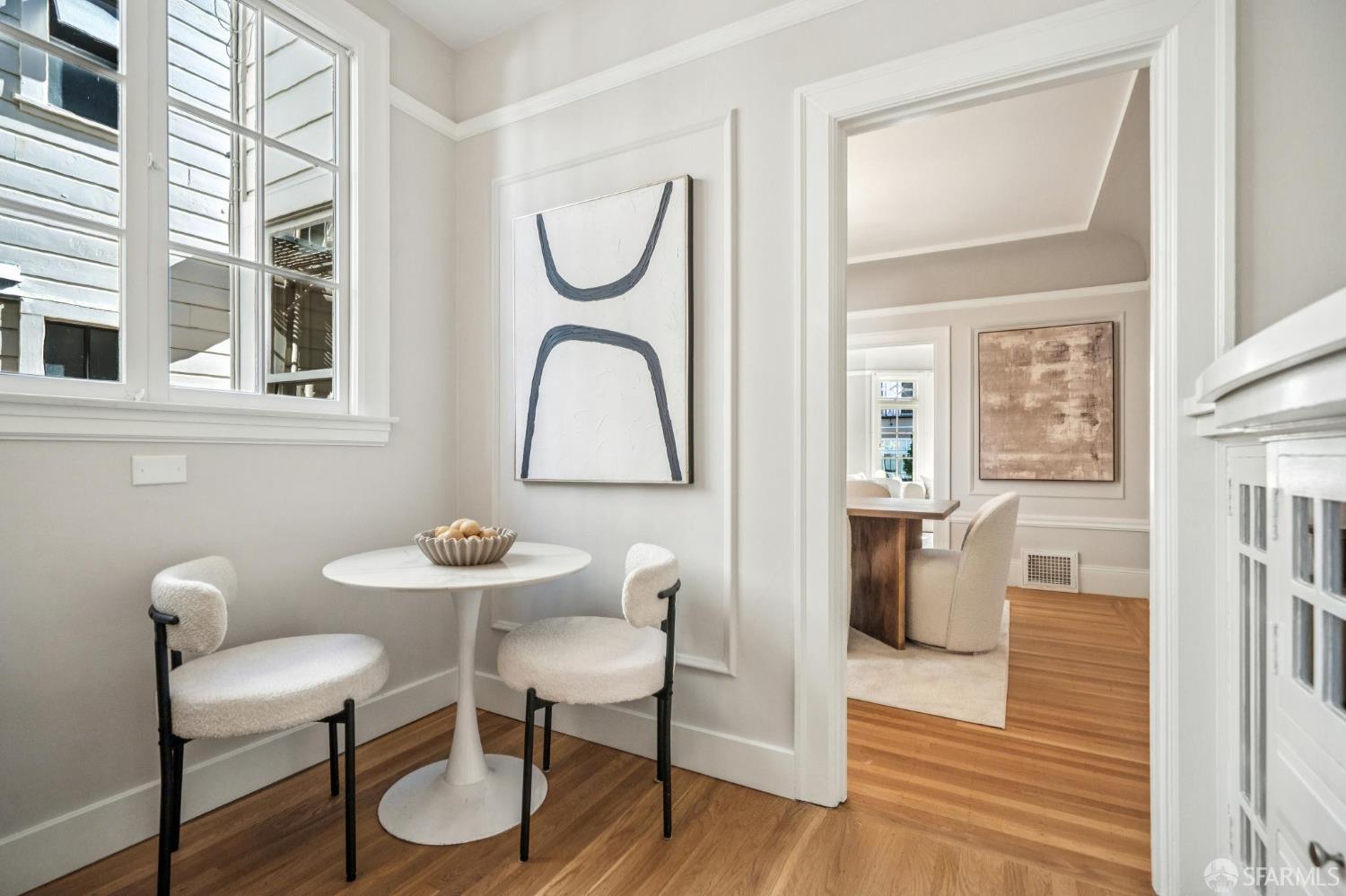 2522 Chestnut Street San Francisco, CA 94123 - Photo 14 of 34 a view of a dining room with furniture window and wooden floor