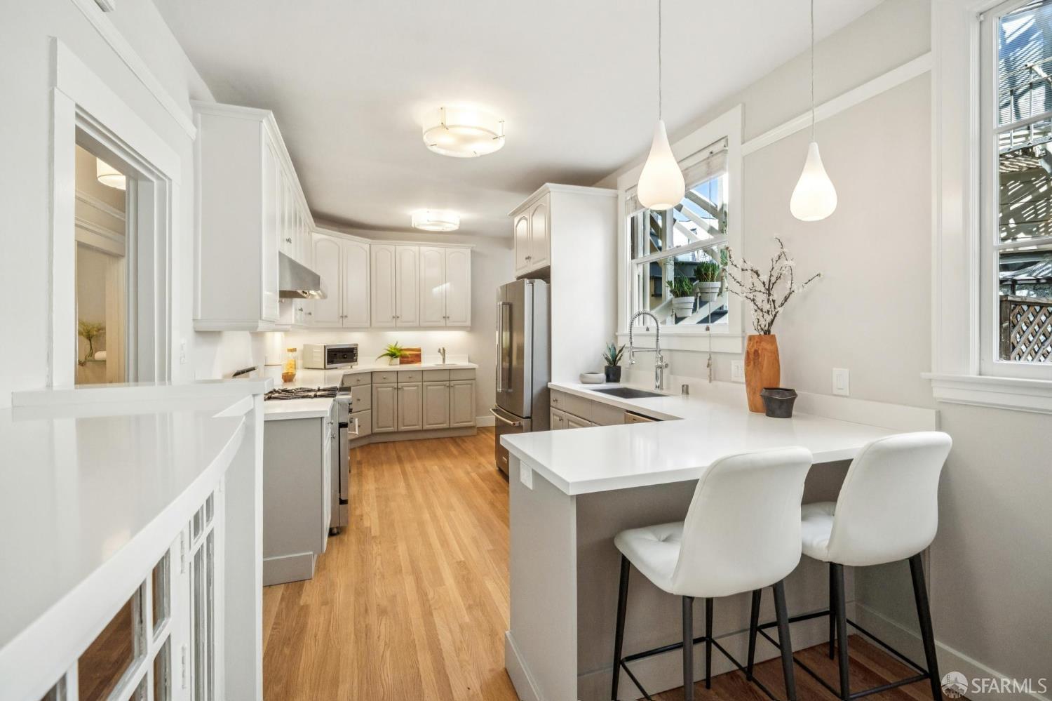 2522 Chestnut Street San Francisco, CA 94123 - Photo 15 of 34 a kitchen with a sink a counter top space and appliances