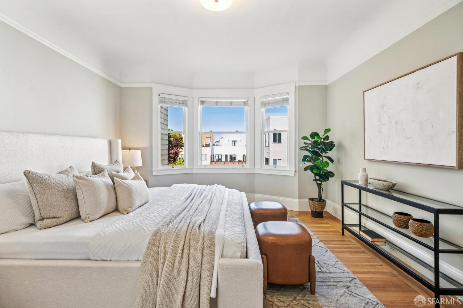 2522 Chestnut Street San Francisco, CA 94123 - Photo 25 of 34 a bedroom with furniture and a potted plant