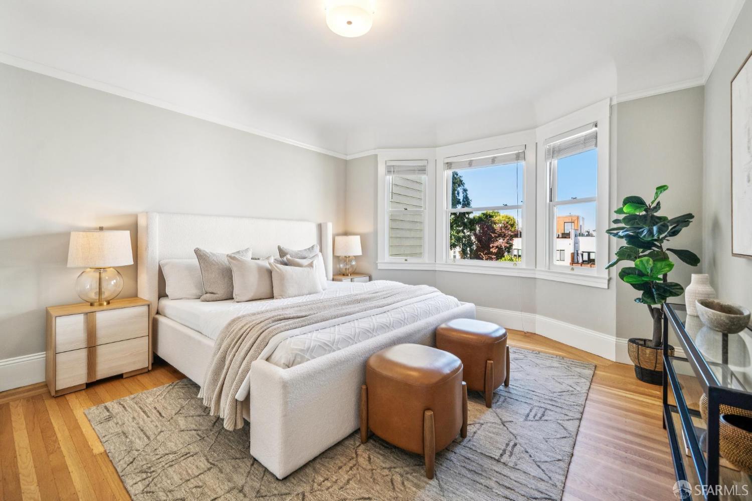 2522 Chestnut Street San Francisco, CA 94123 - Photo 26 of 34 a bedroom with bed and wooden floor
